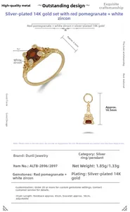 Macro-opname van de Eiffeltoren hanger en granaatring in 14K verguld zilver