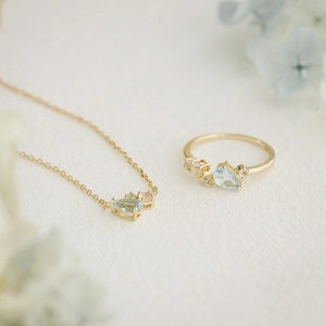 Elegant gold S925 silver necklace and ring set with sky blue pear-cut topaz stones