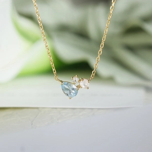 S925 gold plated necklace with blue topaz teardrop pendant and multi-gemstone clusters