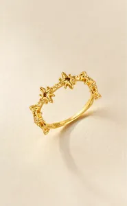 Detailed macro view of S925 sterling silver ring with 14K gold plated hollow stars