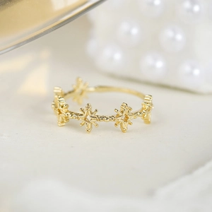 Macro shot of gold-plated S925 silver lace ring with hollow star pattern design