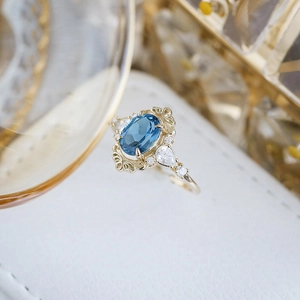 Vintage S925 silver ring with oval London blue topaz and 14K gold plated accents