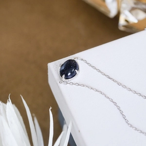 S925 sterling silver bracelet featuring an oval blue sandstone in a four-prong setting