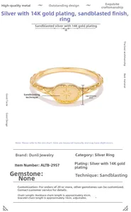 Detail view of S925 sterling silver ring with 14K gold plating and starburst pattern