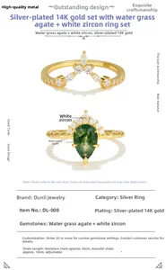 Detail of pear-shaped moss agate silver ring set with V-shaped pavé zircon bands