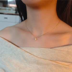 Elegant natural opal necklace in S925 sterling silver worn by a model on collarbone