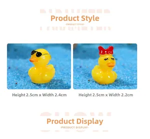 Detail view of miniature resin ducks featuring cool sunglasses and sweet red bow styles