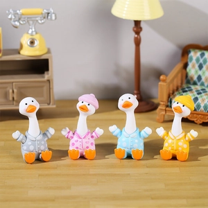 Set of four cute resin duck figurines in colorful polka dot pajamas for desk decor