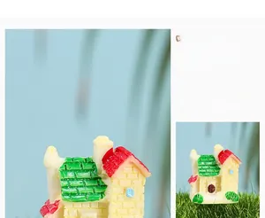 Detailed view of miniature resin house with brick texture and waterproof glue coating