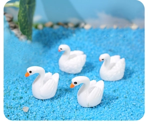 Miniature resin swans set of 4 for succulent landscape decoration on blue sand