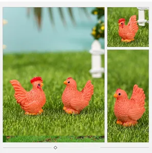 Detailed view of miniature resin rooster and hen figures with realistic feather texture
