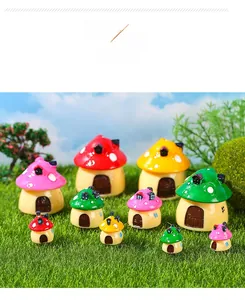 Macro detail of colorful miniature resin mushroom houses for moss micro landscape decor
