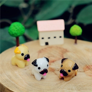 Detailed close-up of colorful resin pug dog figurines for DIY micro landscape decor