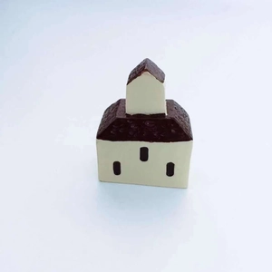 Detailed close-up of a miniature resin castle house for moss landscape decoration