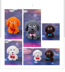 Detailed view of colorful miniature resin teddy dog figurines with matte texture finish