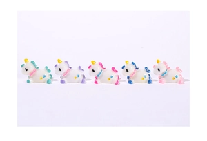 Set of five colorful miniature unicorn figurines with star details for micro landscapes