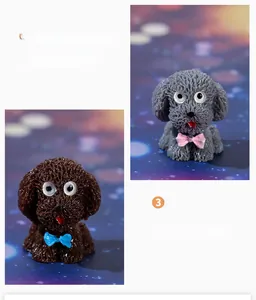 Detailed view of miniature resin teddy dogs with large eyes and colorful bowties