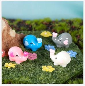 Group of four mini resin elephants with heart shapes for micro landscape succulent decor