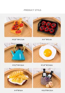 Set of six resin 3D food magnets including croissants and wine basket on wooden trays