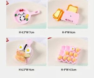 Detailed view of DIY resin food miniatures including pink panda pan and toaster accessories