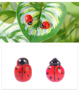 Macro detail of red wooden ladybug ornaments for micro landscape and DIY crafts