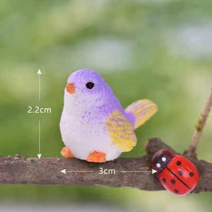 Miniature resin bird and ladybug figurines measuring 2.2cm by 3cm for moss decor
