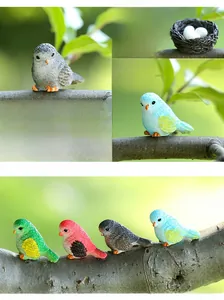 Detailed view of eight colorful resin bird figurines with fine carved feather textures