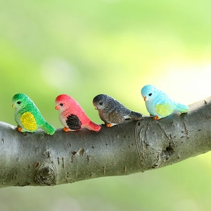 Set of four colorful resin bird figurines on a branch for moss micro landscape decor