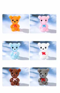Close-up of colorful resin mini bear figurines with matte texture and cute bows
