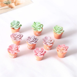 Close-up of 9 miniature flocked succulent plants in Sunny Day pots for dollhouse décor