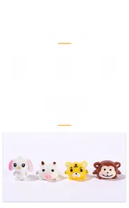 Close-up of mini resin animal figurines including a rabbit, cow, tiger, and monkey