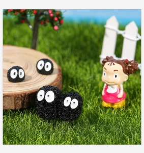 Miniature resin soot sprites figurines and Mei character on a green lawn landscape