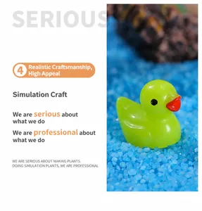 Macro view of a miniature translucent green resin duckling for terrarium scenery decoration