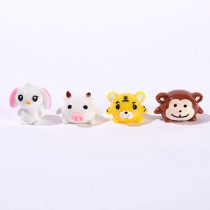 Miniature resin cartoon animal figures featuring rabbit, cow, tiger and monkey desktop decor