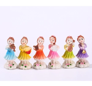 Set of six fairy resin figurines playing musical instruments on cloud bases with roses