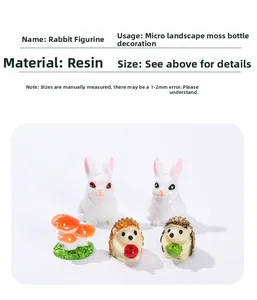 Detail of miniature resin figurines featuring cute white rabbits, hedgehogs, and mushrooms