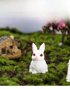 Close-up of a cute miniature white resin bunny with detailed fur texture for micro landscapes