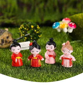 Mini resin couple figurines in ancient attire on moss grass for micro landscapes