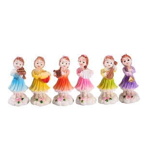Set of 6 colorful fairy figurines playing musical instruments on white cloud bases