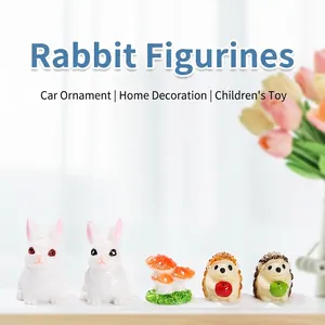 Miniature resin garden ornaments featuring cute white rabbits, hedgehogs and mushrooms