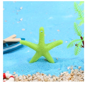 Macro view of green resin starfish pendant with realistic texture on a beach scene