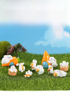 Close-up of miniature resin rabbits with carrots for succulent pot and DIY micro landscape