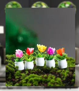 Detail view of five colorful dollhouse tulip pots in red, yellow, and pink colors