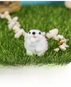 Close-up of a resin hedgehog miniature used for home decor and car dashboard ornament