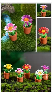 Macro shot of colorful miniature dollhouse potted plants on a realistic moss landscape