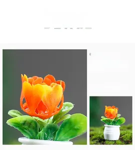 Detailed close-up of a miniature dollhouse potted plant with orange flowers and white pot