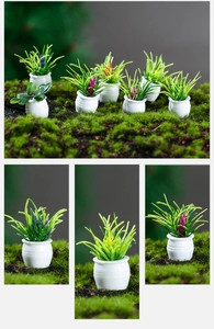 Detailed close-up of miniature dollhouse potted plants with colorful resin flowers