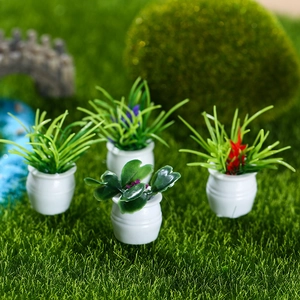 Set of four miniature dollhouse potted plants with colorful flowers in white resin pots