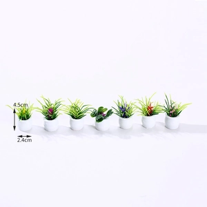 Set of seven miniature dollhouse potted plants with colorful flowers in white pots