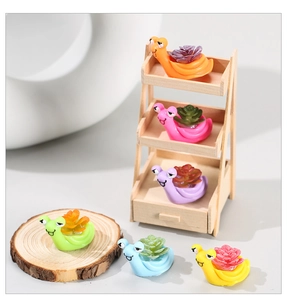 Detailed view of six colorful cartoon snails with succulent plants on a wooden shelf